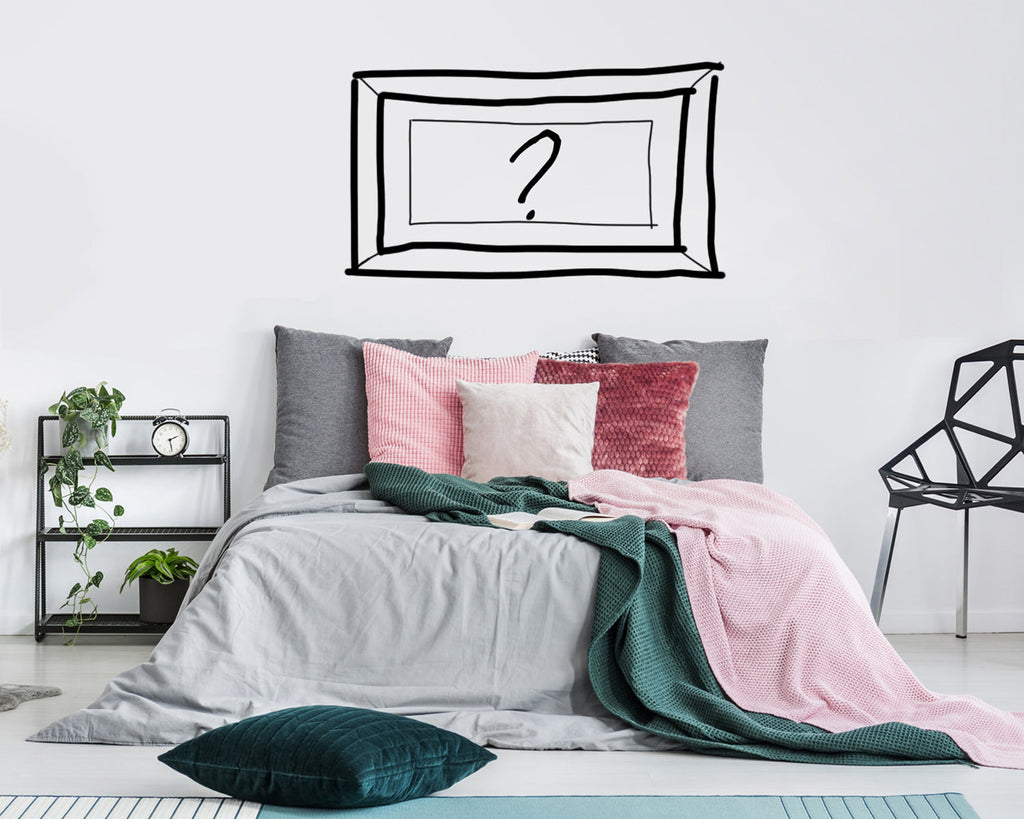 How to hang pictures in a bedroom